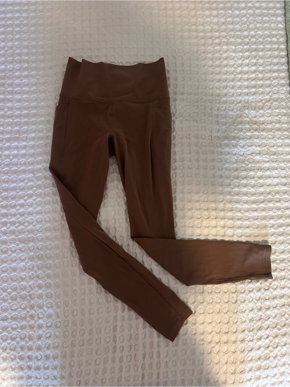 Athleta Salutation Stash Tight in Warm Brown